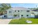 Well-manicured home has a lush lawn and attached two-car garage at 8704 Bay Crest Ln, Tampa, FL 33615
