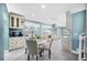 Spacious kitchen with a cozy breakfast nook and modern appliances, seamlessly connecting to dining and living spaces at 8704 Bay Crest Ln, Tampa, FL 33615
