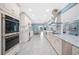 Bright, modern kitchen with stainless appliances, custom cabinets, and easy access to the dining area at 8704 Bay Crest Ln, Tampa, FL 33615