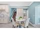 A charming breakfast nook next to the kitchen features a round table with seating and a staircase at 8704 Bay Crest Ln, Tampa, FL 33615