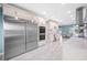 A spacious kitchen showcases stainless steel appliances, white cabinetry, and marble countertops at 8704 Bay Crest Ln, Tampa, FL 33615