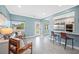 Open-concept living space with tile floors, bar seating, and stylish decor at 8704 Bay Crest Ln, Tampa, FL 33615