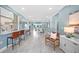 Open-concept living space with tile floors, bar seating, and stylish decor at 8704 Bay Crest Ln, Tampa, FL 33615