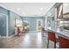 Open-concept living space with tile floors, bar seating, and stylish decor at 8704 Bay Crest Ln, Tampa, FL 33615