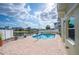 A beautiful pool and patio area overlooks the canal at 8704 Bay Crest Ln, Tampa, FL 33615