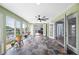 Spacious sunroom boasts tile floors, lots of natural light, and views of the canal at 8704 Bay Crest Ln, Tampa, FL 33615