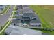 Aerial view of the property with an in-ground pool, dark shingle roof, and easy access to nearby community amenities at 10549 Torchwood Sea Way, San Antonio, FL 33576