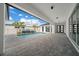 An open patio with a pool area, offering ample space for outdoor entertaining and relaxation at 10549 Torchwood Sea Way, San Antonio, FL 33576