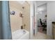 Clean and bright bathroom showcasing the shower with a built in toiletry shelf at 10549 Torchwood Sea Way, San Antonio, FL 33576
