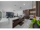 Bright, open kitchen and dining area with modern appliances and access to the patio at 10549 Torchwood Sea Way, San Antonio, FL 33576