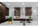Contemporary kitchen showcasing sleek countertops, stainless steel appliances, and stylish fixtures at 10549 Torchwood Sea Way, San Antonio, FL 33576