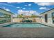 A refreshing pool and seating provide a serene backyard oasis for relaxing and enjoying the outdoors at 10549 Torchwood Sea Way, San Antonio, FL 33576