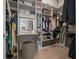 Walk-in closet offering ample shelving and storage, featuring a vanity with lighted mirror at 10549 Torchwood Sea Way, San Antonio, FL 33576