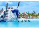 Community water park with slides and swim area on a sunny day at 10549 Torchwood Sea Way, San Antonio, FL 33576