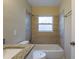 Well-maintained bathroom with tiled shower-tub and a granite vanity offering comfort and style at 2333 33Rd S St, St Petersburg, FL 33712