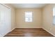 Cozy bedroom featuring wood floors, natural light, and a closet for ample storage space at 2333 33Rd S St, St Petersburg, FL 33712