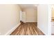 A light and airy living room features wood-look floors and leads to the kitchen at 2333 33Rd S St, St Petersburg, FL 33712