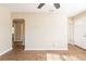 Bright living room featuring wood floors, arched doorway, and neutral paint, ready for personal touches at 2333 33Rd S St, St Petersburg, FL 33712