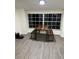 Dining room with large window and modern table with bench seating at 2902 Little Rd, Valrico, FL 33596