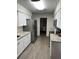 Modern kitchen with stainless steel appliances and beautiful countertops at 2902 Little Rd, Valrico, FL 33596