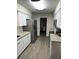 Updated kitchen features stainless steel appliances and granite countertops at 2902 Little Rd, Valrico, FL 33596