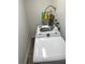 Well-equipped laundry room featuring a modern washing machine and ample shelving at 2902 Little Rd, Valrico, FL 33596