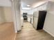Modern kitchen with stainless steel appliances, bright white cabinets, and an eat-in area at 1424 Pine Glen Ln # D2, Tarpon Springs, FL 34688