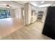 Inviting kitchen with bright cabinetry, stainless steel appliances, and an open layout to the living area at 1424 Pine Glen Ln # D2, Tarpon Springs, FL 34688