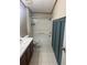 Neat bathroom featuring a shower-tub combination, tiled floors, and a vanity sink at 4435 Tevalo Dr, Valrico, FL 33596