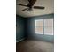 Cozy bedroom featuring plush carpeting, natural light, and a ceiling fan at 4435 Tevalo Dr, Valrico, FL 33596
