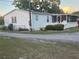 Cozy home featuring an enclosed porch, a fenced yard, and convenient driveway access at 4435 Tevalo Dr, Valrico, FL 33596