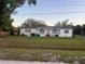 Spacious single-story residence with a lush front yard and a charming covered entryway at 4435 Tevalo Dr, Valrico, FL 33596