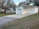 Detached garage with ample parking space and a clean, white exterior at 4435 Tevalo Dr, Valrico, FL 33596