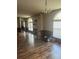 Bright living room with a chandelier and arched windows at 4435 Tevalo Dr, Valrico, FL 33596