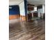 Open-concept living and dining area with hardwood-style flooring at 4435 Tevalo Dr, Valrico, FL 33596