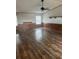 Large living room with ceiling fan and wainscoting at 4435 Tevalo Dr, Valrico, FL 33596