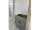 Newly installed gray bathroom cabinet, backsplash, and marble tile flooring at 24462 Cabana Rd, Punta Gorda, FL 33955