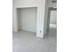 Empty bedroom with white marble tile flooring. Perfect for personalization at 24462 Cabana Rd, Punta Gorda, FL 33955