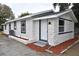 Charming single-story home with stucco and stone accents, updated windows, fresh paint, and newly landscaped at 316 21St W St, Palmetto, FL 34221