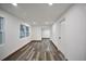 Bright living room boasts modern flooring, recessed lighting, and fresh paint, creating a move-in-ready space at 316 21St W St, Palmetto, FL 34221
