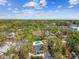 Neighborhood view with homes surrounded by trees and a swimming pool at 913 Tennessee Ln, Sarasota, FL 34234