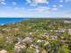Picturesque aerial view showcasing a lush residential area near the serene blue waters of the Gulf at 913 Tennessee Ln, Sarasota, FL 34234