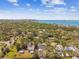 Sweeping aerial captures a neighborhood adjacent to a bustling city and the calm waters of the Gulf at 913 Tennessee Ln, Sarasota, FL 34234