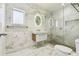Modern bathroom featuring marble and a glass shower at 913 Tennessee Ln, Sarasota, FL 34234