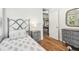 Bedroom featuring wood floors and stylish bedside table at 913 Tennessee Ln, Sarasota, FL 34234
