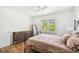 Bright bedroom featuring a full-length mirror and two windows that provide ample natural light at 913 Tennessee Ln, Sarasota, FL 34234