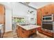 Beautiful kitchen with stainless steel appliances and a large island with granite countertops at 913 Tennessee Ln, Sarasota, FL 34234