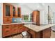 Renovated kitchen featuring granite counters, stainless steel appliances and hardwood cabinets at 913 Tennessee Ln, Sarasota, FL 34234