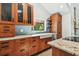 Well-appointed kitchen featuring granite counters, stainless steel appliances and hardwood cabinets at 913 Tennessee Ln, Sarasota, FL 34234