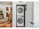 Efficient laundry closet with stacked washer and dryer, conveniently located near the main living area at 913 Tennessee Ln, Sarasota, FL 34234
